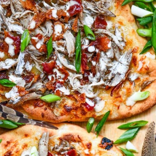 Pheasant Pizza. A great flatbread pizza recipe with bacon, cheese, green onions, and Alabama White Sauce.