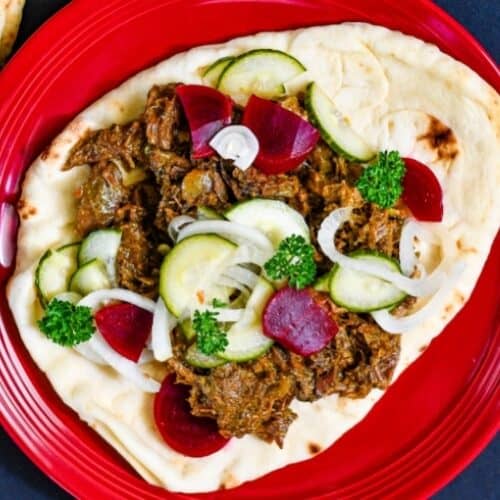 Venison Shawarma and a quick pickled salad on garlic naan.