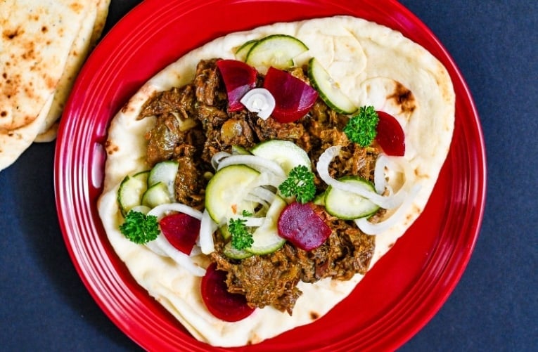 Venison Shawarma and a quick pickled salad on garlic naan.