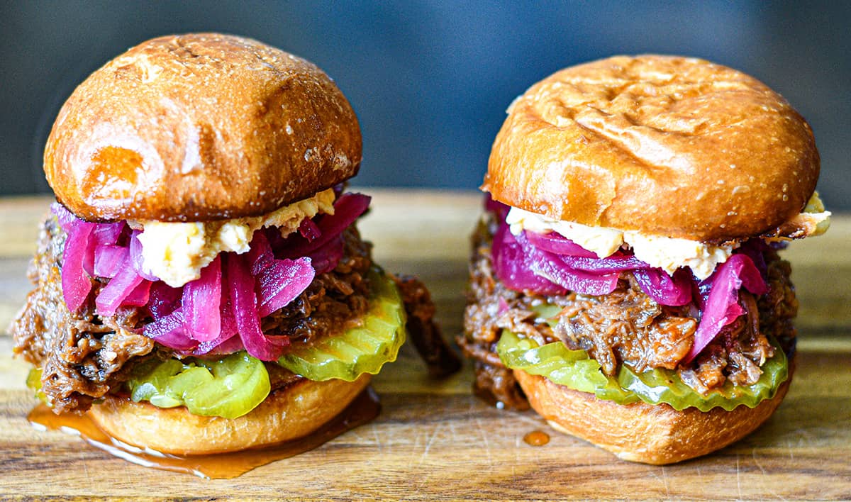 Deer BBQ Sandwiches with Pimento Cheese, Pickled Red Onions, and dill pickle chips