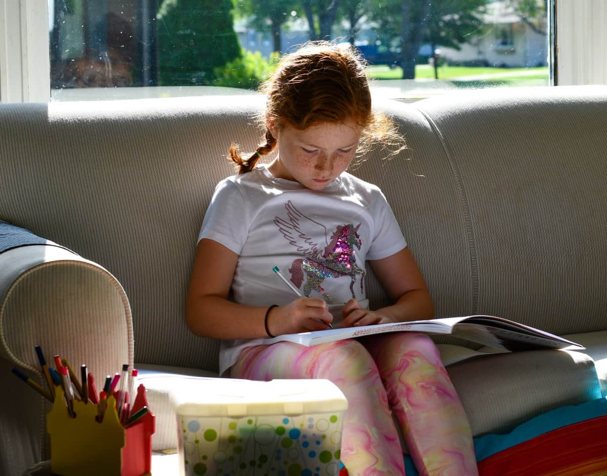 Daughter sitting on couch