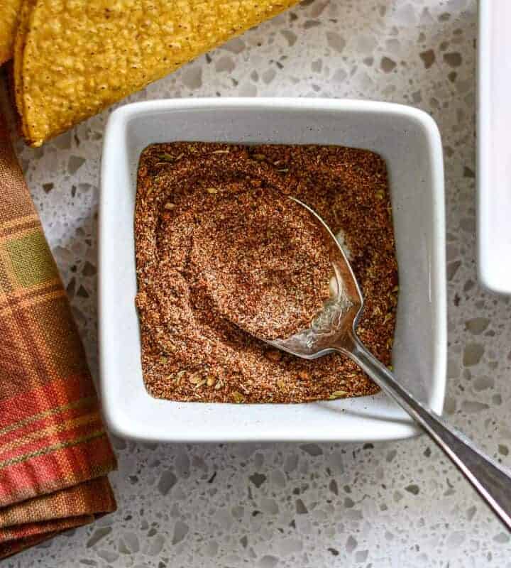 Homemade Taco Seasoning Recipe with napkin hardshell taco shells and diced tomatoes