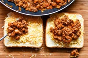 Sloppy Joe mix on open faced grilled cheese sandwich