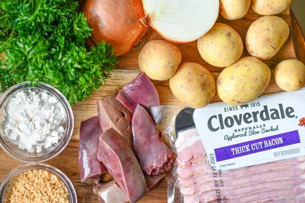 Fried Liver and Onions Ingredients including bacon, liver, flour, onions, potatoes, and parsley for garnish