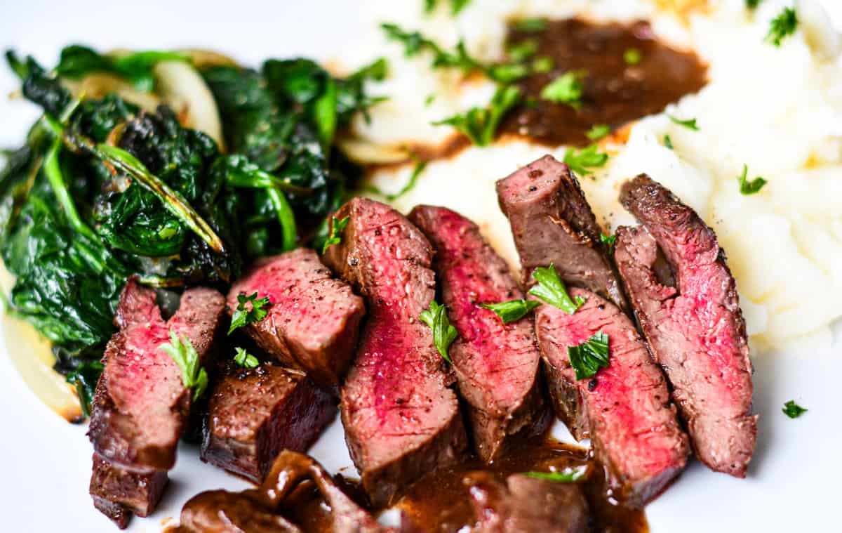 Pan Fried Deer Heart with Sauteed Spinach and Mashed Potatoes and Gravy