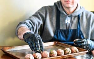 Jeff Benda making Swedish meatballs into 1-inch balls