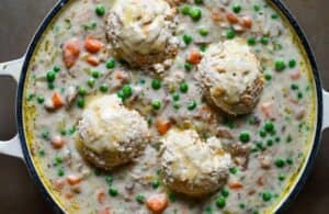 Pillsbury biscuit dough arranged on top of pheasant pot pie filling before baking