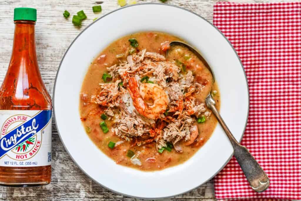 Creole Pheasant Gumbo with andouille sausage and shrimp with hot sauce on the side.