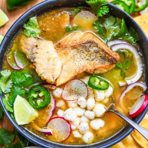 Green Pozole Recipe with Fish, Hominy, Radish, Cilantro, and Jalapenos.