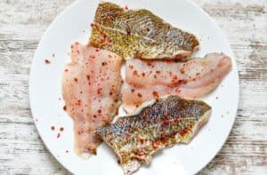 Walleye Fillets, cut in half, and seasoned with kosher salt and pink peppercorns