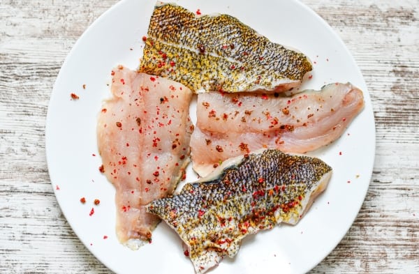 Walleye Fillets seasoned with kosher salt and pink peppercorns