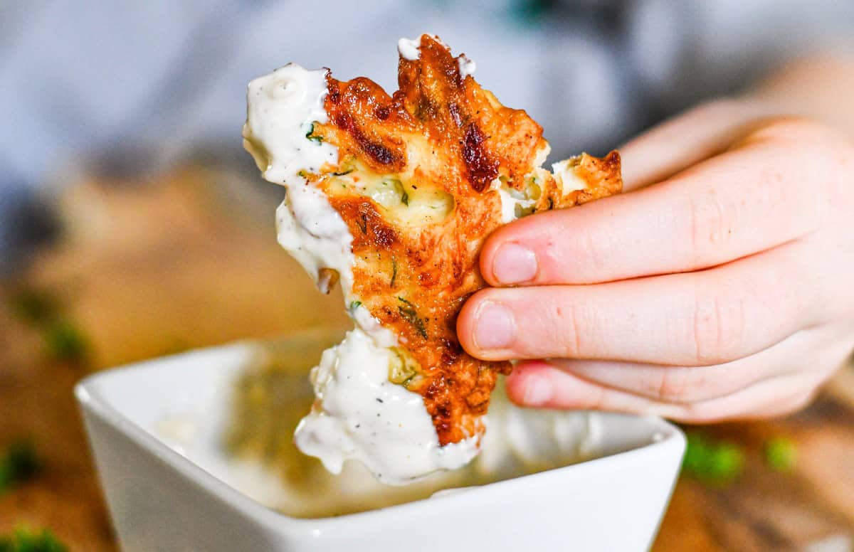 Fritter dipping in garlic aioli