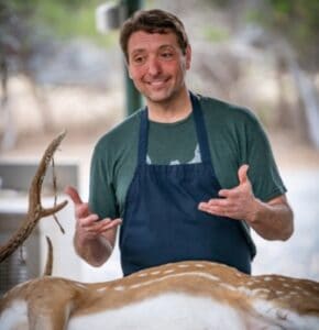 Jeff Benda teaching how to butcher Axis Deer