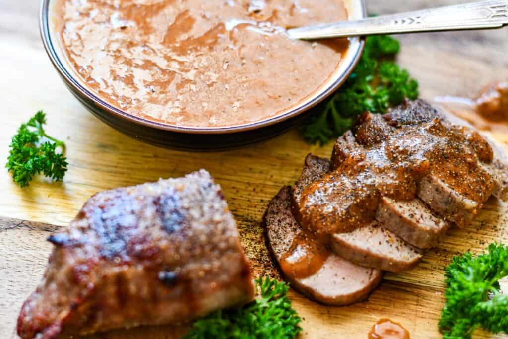 Homemade steak sauce recipe with sliced venison steak