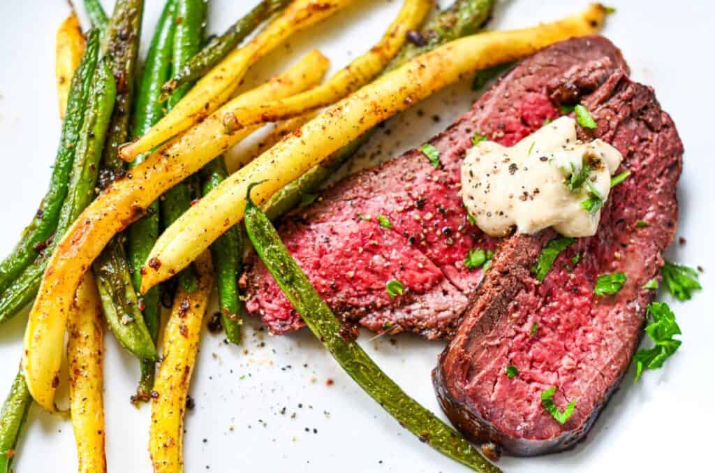 Grilled Venison steak with Bearnaise Sauce with a side of sauteed green beans