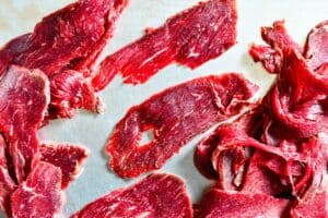 Learn how to make deer jerky by using thin slices of deer roast