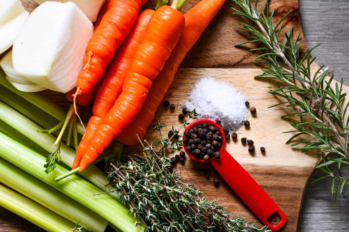 Wild Turkey Stock Ingredients including onion, carrot, celery, fresh thyme, fresh rosemary, salt, black pepper