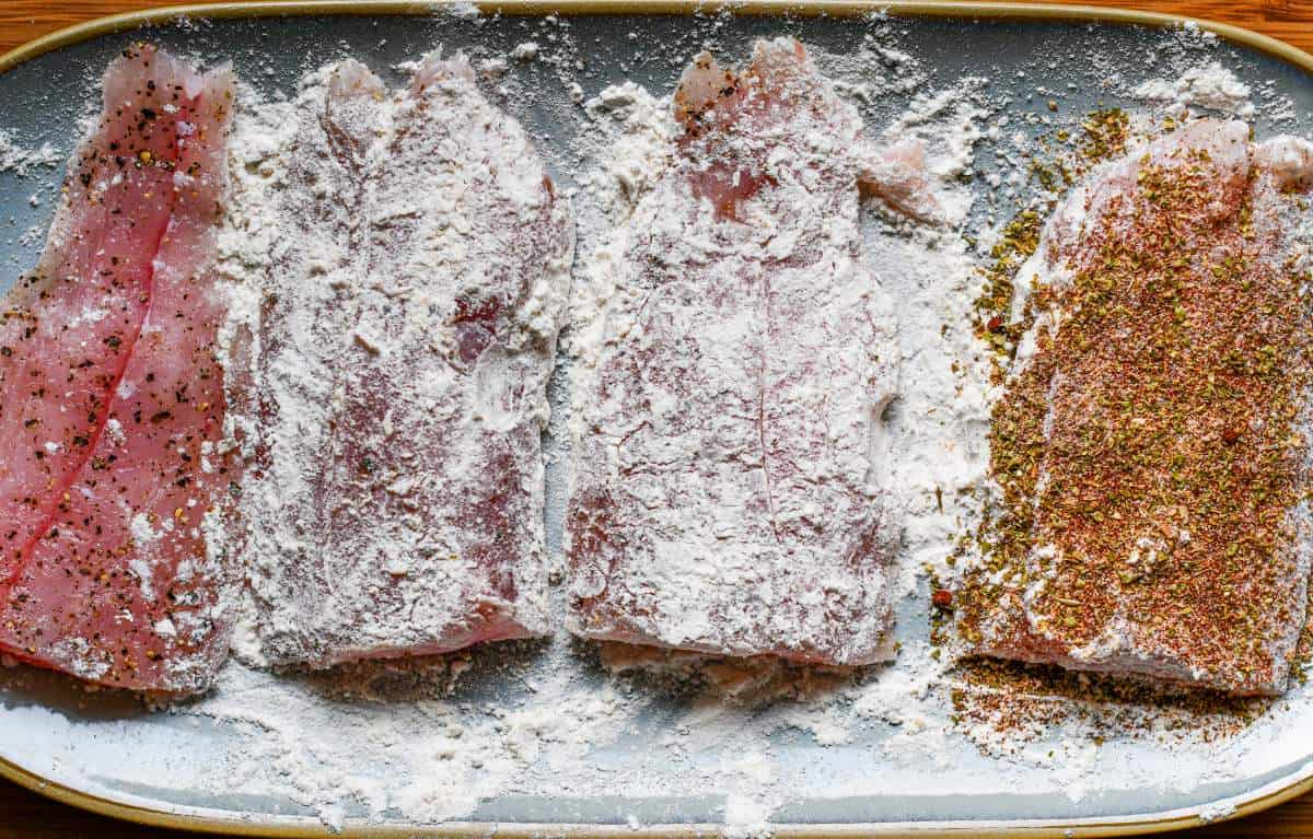 The Speckled Trout seasoned with salt, pepper, paprika, garlic powder, and oregano before dredged in flour