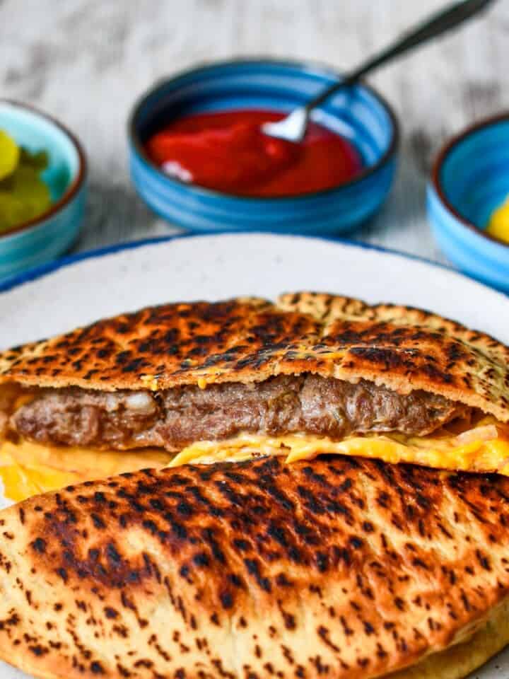 Pita Burger with pickles mustard and ketchup