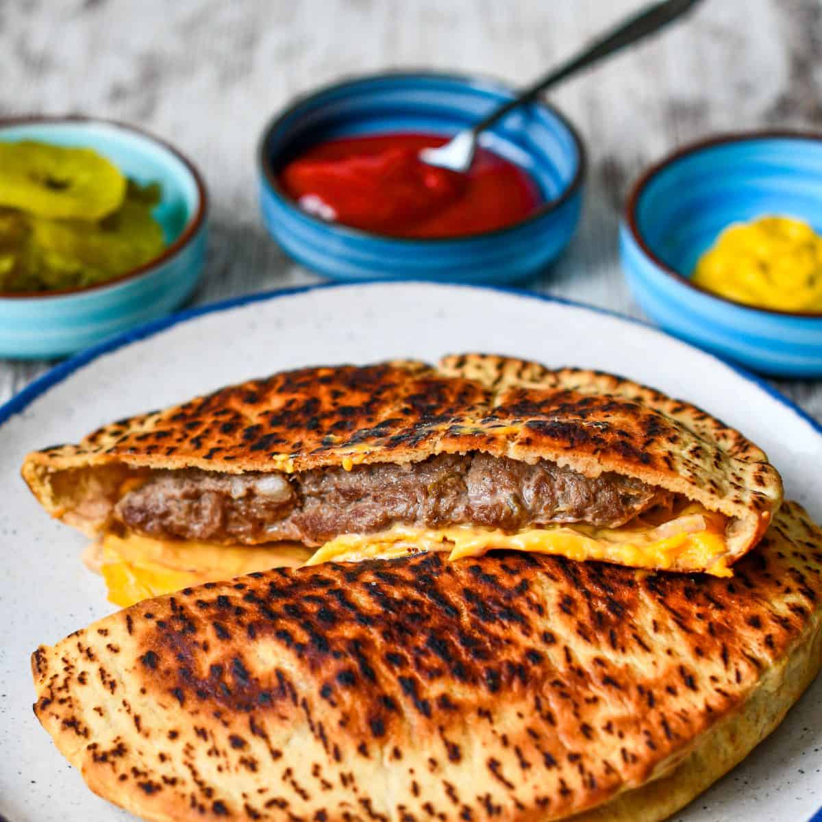 Pita Burger with pickles mustard and ketchup