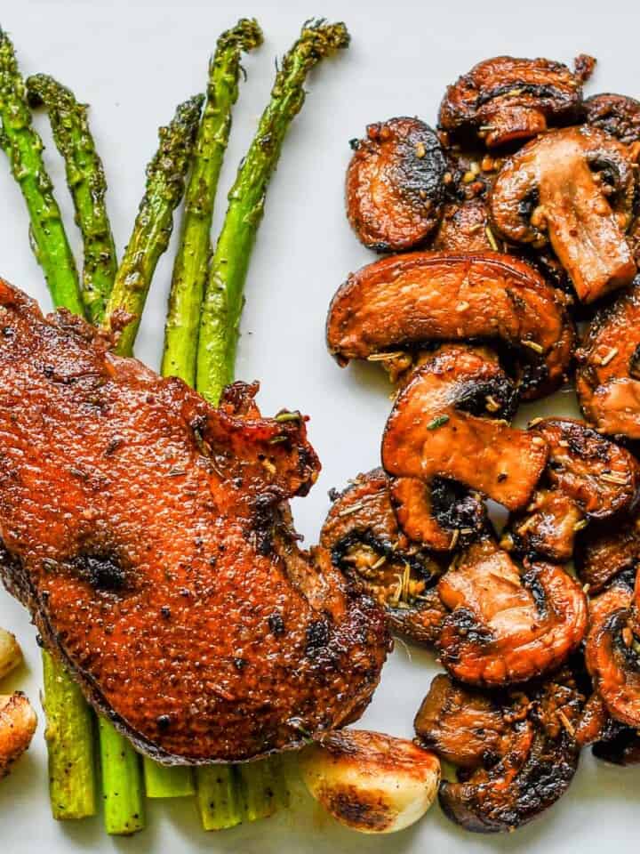 Crispy Duck Breast with Garlic Herb Butter Mushrooms and Asparagus