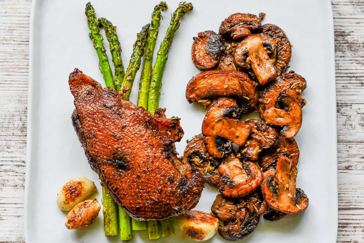 Crispy Duck Breast with Garlic Herb Butter Mushrooms with Asparagus