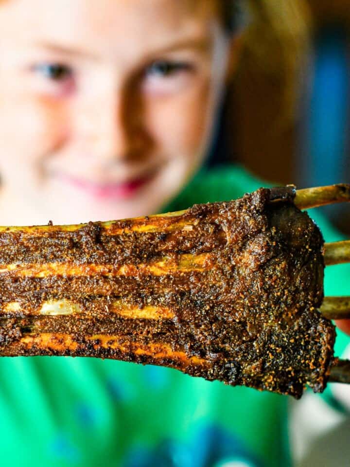 Dutch Oven Deer Ribs held by Jeff Benda's daughter